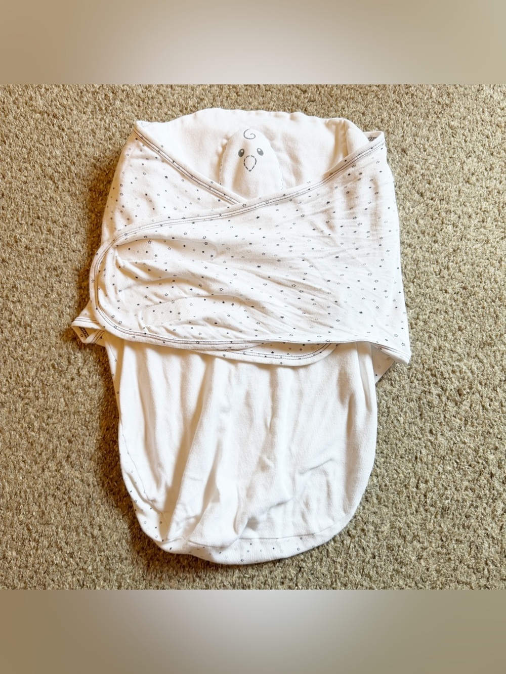 Nested Bean Zen Swaddle in a white star pattern